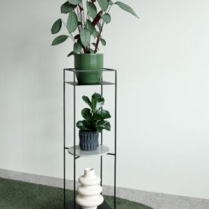 A minimalist and elegant metal black pedestal with a lightweight and airy design, perfect for various interiors.