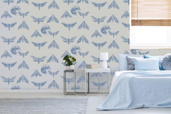 Amazing Moths wallpaper with a pearl grey background, featuring blue moths and the moon in stippling technique.