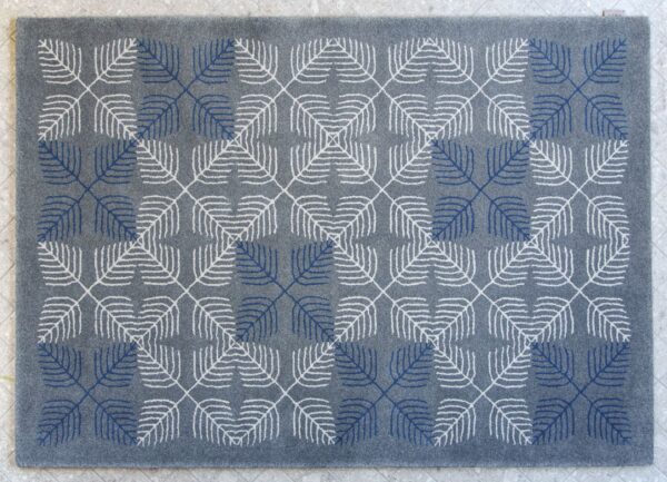 geometric rug design in soft blue and grey