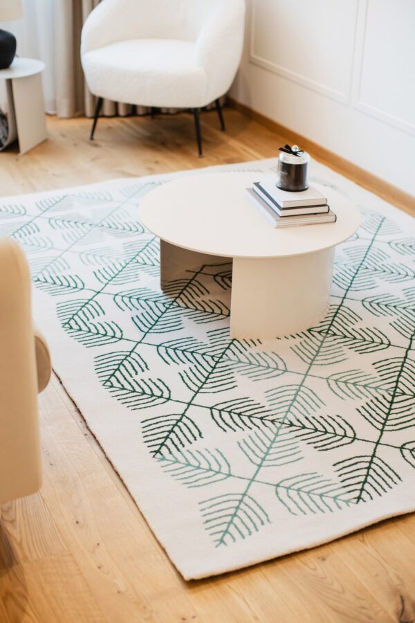 Raho rug with symbolic Tree of Life motif in green tones