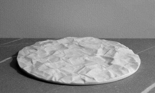 Arid white porcelain serving tray with crumpled paper texture, matte finish